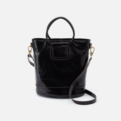 Truffle Collection structured bucket bag with cross body strap in black
